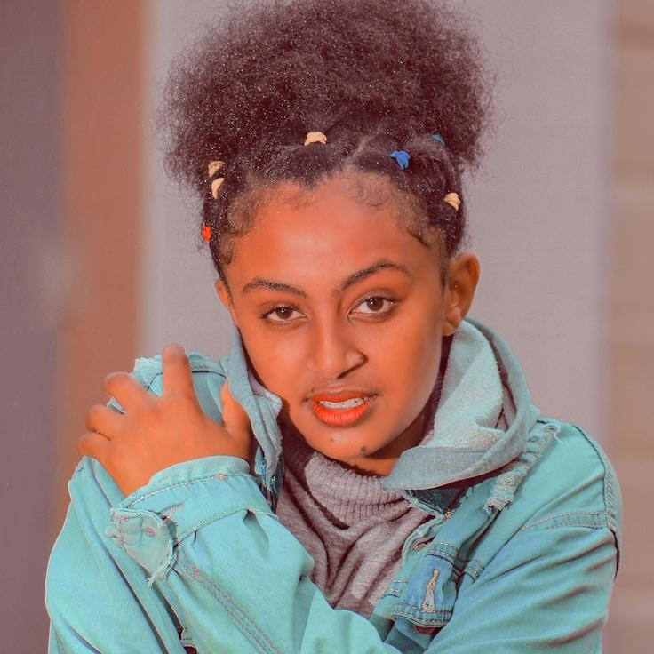 Kaveri Mehta, Lead Design Curator at GlimpseAuroraField, reviewing corporate floral arrangements